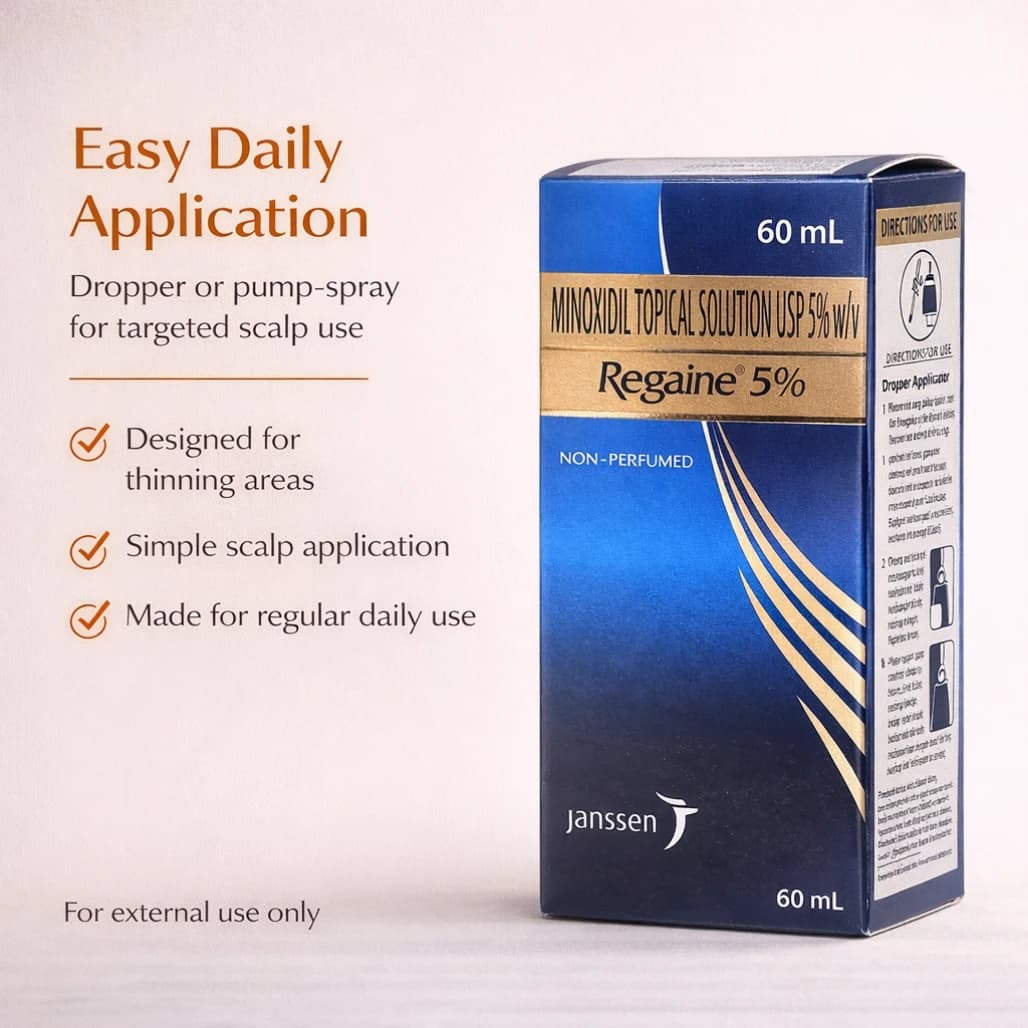 Regaine Minoxidil 5% application to thinning scalp — twice-daily hair regrowth routine